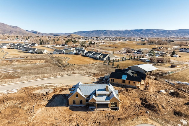 birds eye view of property featuring a mountain view and a residential view