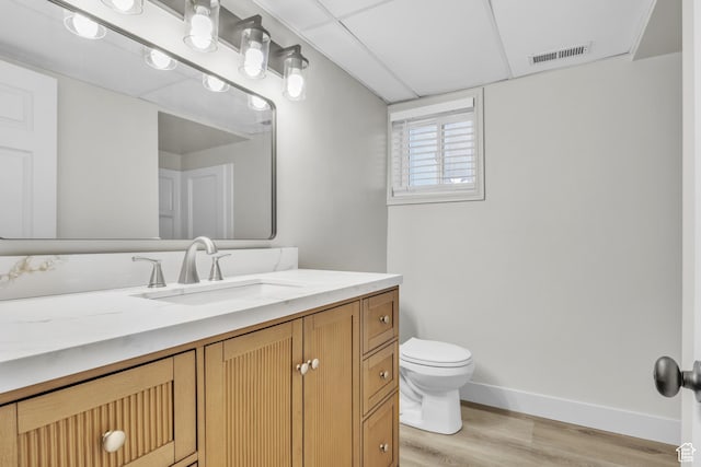 1838 W 13070 S, Riverton, UT 84065 - bathroom featuring vanity, toilet, baseboards, visible vents, and wood finished floors