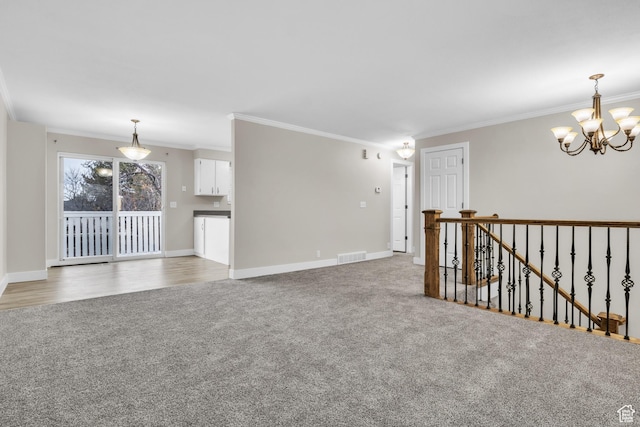 1838 W 13070 S, Riverton, UT 84065 - empty room featuring crown molding, light colored carpet, a notable chandelier, and visible vents