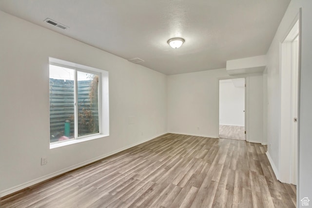 241 E Utah Ave, Tooele, UT 84074 - spare room featuring visible vents, light wood-type flooring, and baseboards