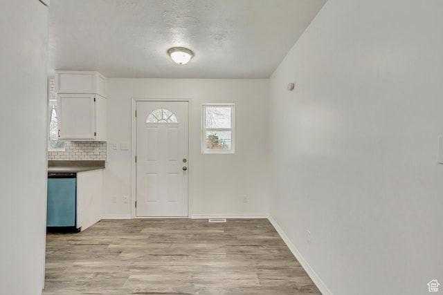241 E Utah Ave, Tooele, UT 84074 - foyer with light wood-style floors and baseboards