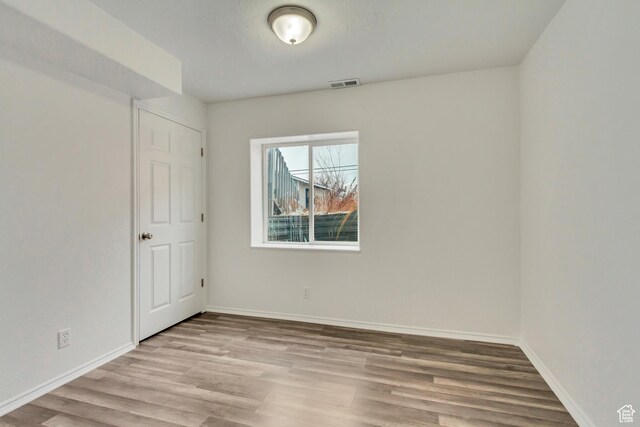 241 E Utah Ave, Tooele, UT 84074 - spare room featuring visible vents, baseboards, and wood finished floors