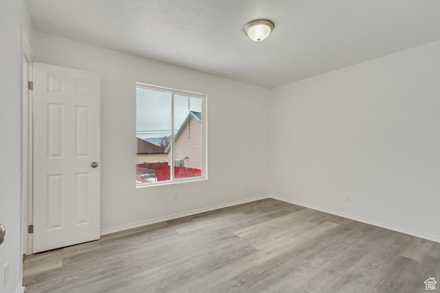 241 E Utah Ave, Tooele, UT 84074 - unfurnished room featuring baseboards and wood finished floors