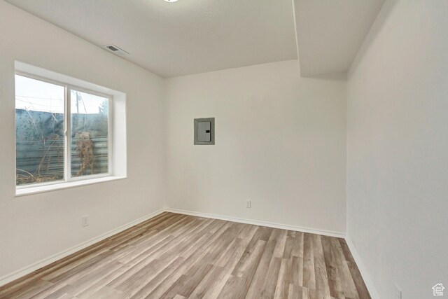 241 E Utah Ave, Tooele, UT 84074 - spare room featuring light wood-style flooring, electric panel, baseboards, and visible vents