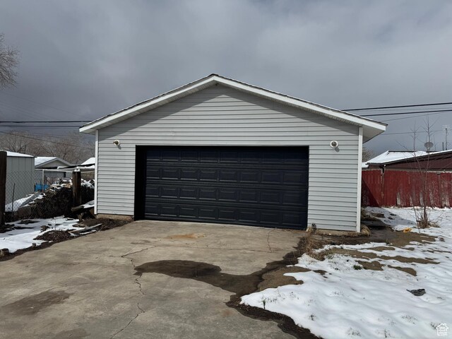 241 E Utah Ave, Tooele, UT 84074 - snow covered garage with fence