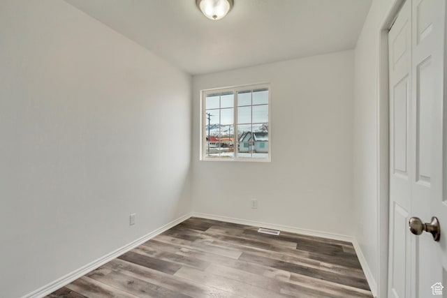 241 E Utah Ave, Tooele, UT 84074 - spare room featuring visible vents, baseboards, and wood finished floors