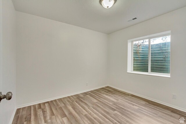 241 E Utah Ave, Tooele, UT 84074 - spare room featuring visible vents, light wood-style flooring, and baseboards