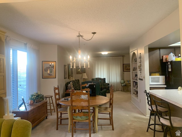 5448 S 925 E, South Ogden, UT 84405 - dining space with light carpet, a textured ceiling, and a notable chandelier