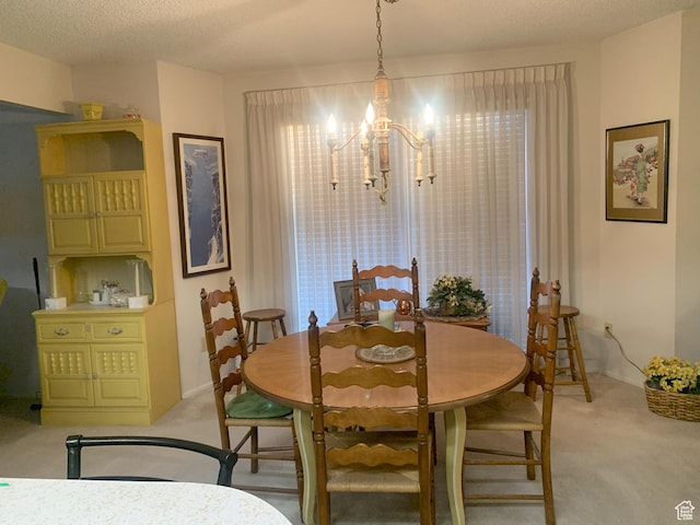 5448 S 925 E, South Ogden, UT 84405 - dining room featuring light carpet, a textured ceiling, and a chandelier