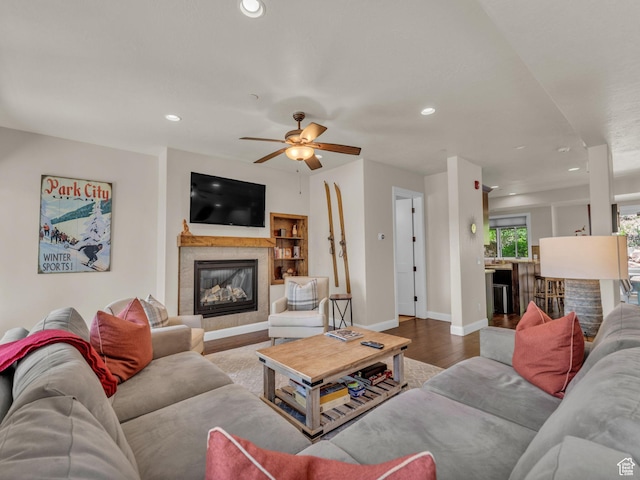 4163 Fairway Ln Unit B-4, Park City, UT 84098 - living room with wood finished floors, a tile fireplace, recessed lighting, ceiling fan, and baseboards