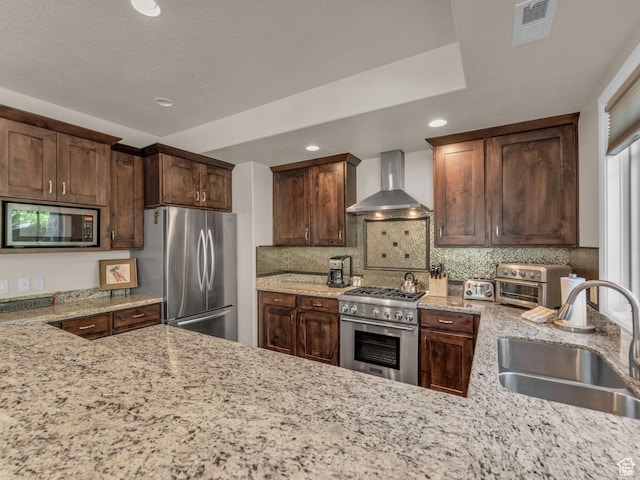 4163 Fairway Ln Unit B-4, Park City, UT 84098 - kitchen featuring wall chimney exhaust hood, stainless steel appliances, a sink, recessed lighting, and backsplash