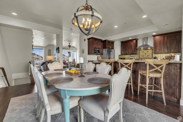 4163 Fairway Ln Unit B-4, Park City, UT 84098 - dining space with ceiling fan with notable chandelier and dark hardwood / wood-style flooring