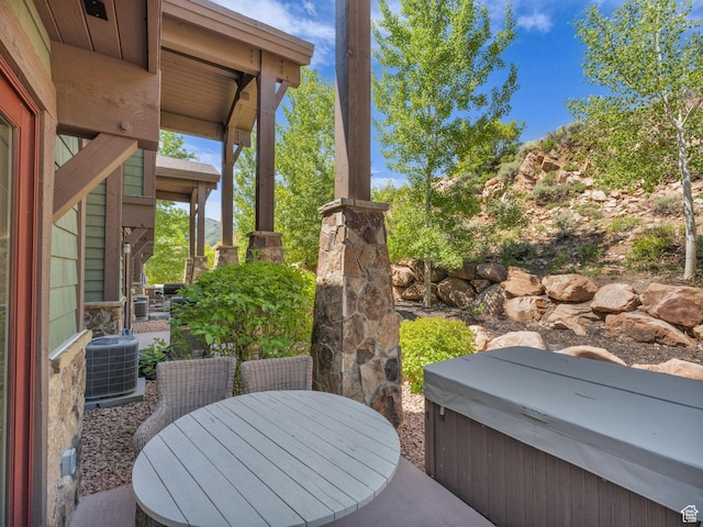4163 Fairway Ln Unit B-4, Park City, UT 84098 - view of patio featuring a hot tub, central AC unit, and outdoor dining space