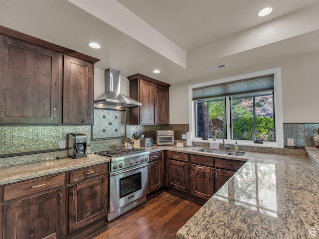 4163 Fairway Ln Unit B-4, Park City, UT 84098 - kitchen with high end stainless steel range, a sink, wall chimney range hood, light stone countertops, and tasteful backsplash
