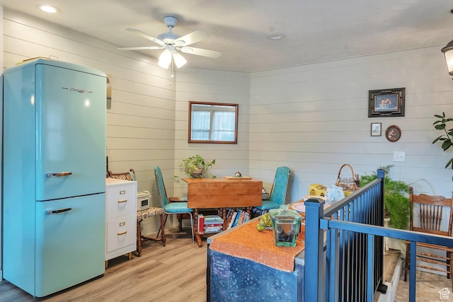 700 S 800 E, Springville, UT 84663 - kitchen featuring fridge, ceiling fan, blue cabinets, and light hardwood / wood-style floors