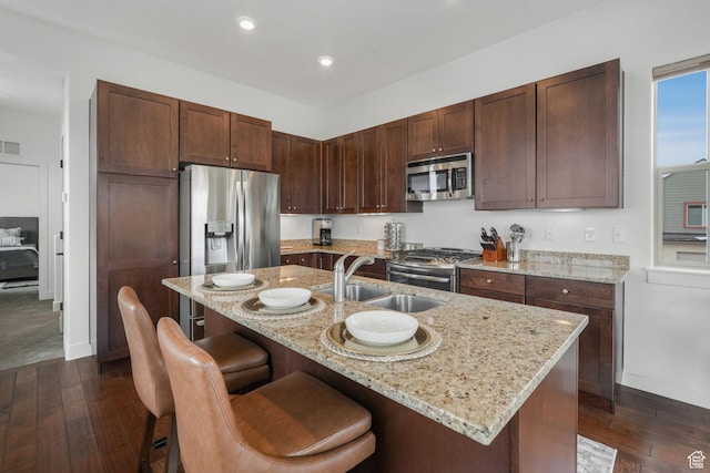 6169 E Park Ln S Unit 60, Park City, UT 84098 - kitchen with sink, light stone countertops, an island with sink, and appliances with stainless steel finishes