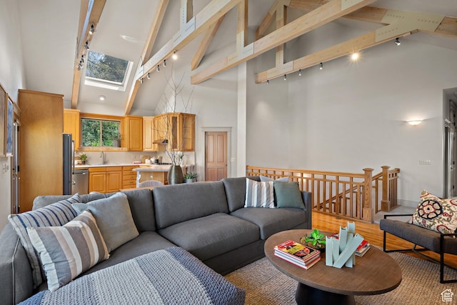 1204 E Gilmer Dr, Salt Lake City, UT 84105 - living area with beam ceiling, a skylight, high vaulted ceiling, and rail lighting