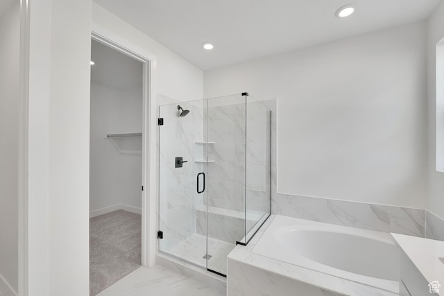 6184 W Teton Ranch Dr S Unit 304, Herriman, UT 84096 - full bathroom featuring a garden tub, a marble finish shower, recessed lighting, marble look tiles, and a walk in closet