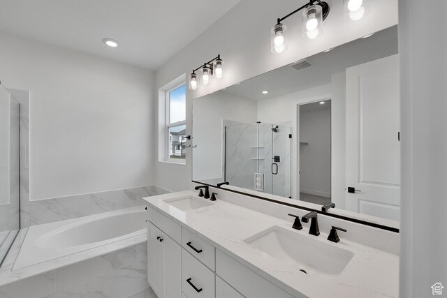 6184 W Teton Ranch Dr S Unit 304, Herriman, UT 84096 - full bath featuring a shower stall, a bath, double vanity, a walk in closet, and recessed lighting