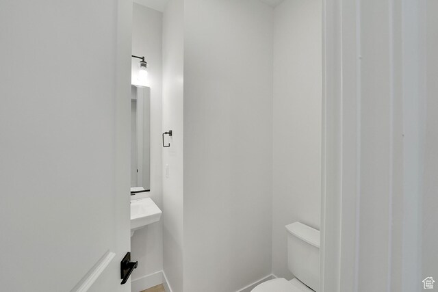6184 W Teton Ranch Dr S Unit 304, Herriman, UT 84096 - half bathroom with toilet and baseboards