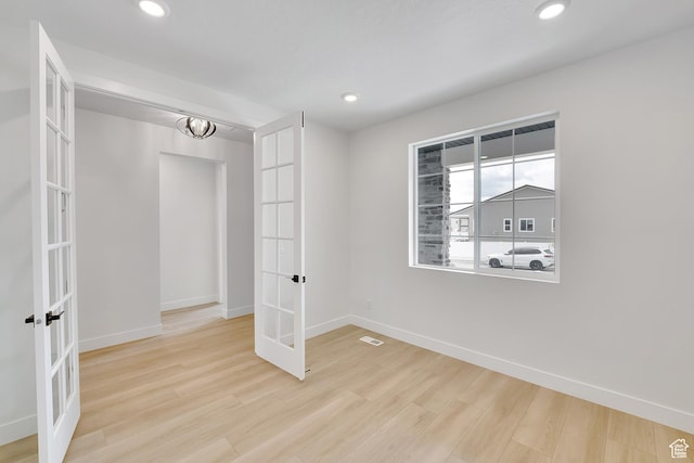 6184 W Teton Ranch Dr S Unit 304, Herriman, UT 84096 - unfurnished bedroom with french doors, baseboards, wood finished floors, and recessed lighting