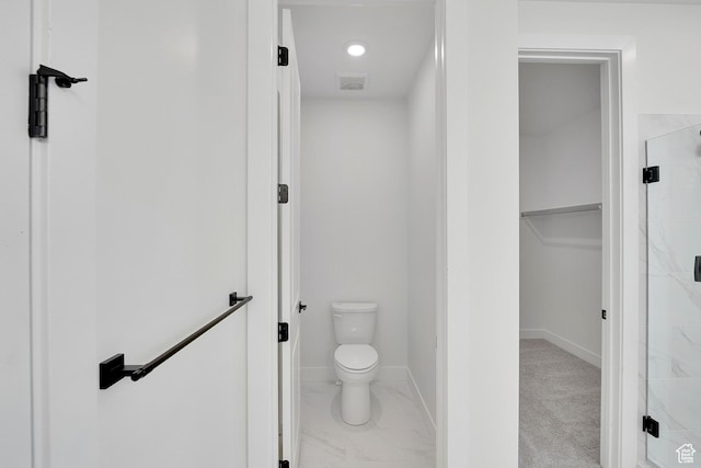6184 W Teton Ranch Dr S Unit 304, Herriman, UT 84096 - full bath with a stall shower, a walk in closet, toilet, marble look tile flooring, and baseboards