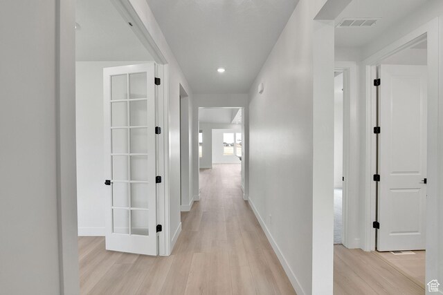 6184 W Teton Ranch Dr S Unit 304, Herriman, UT 84096 - corridor with light wood-type flooring, baseboards, and recessed lighting