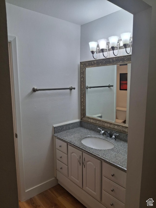 2255 Sidewinder Dr Unit 621, Park City, UT 84060 - bathroom with vanity, hardwood / wood-style flooring, and toilet