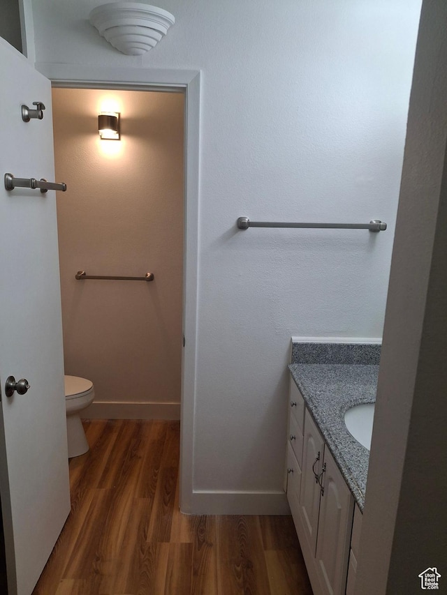 2255 Sidewinder Dr Unit 621, Park City, UT 84060 - bathroom featuring hardwood / wood-style flooring, vanity, and toilet