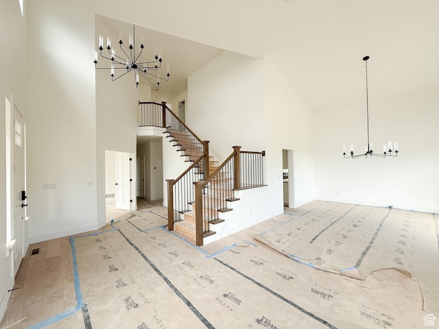 5330 N Springview Ct Unit 105, Lehi, UT 84043 - foyer entrance with high vaulted ceiling, a chandelier, and stairway