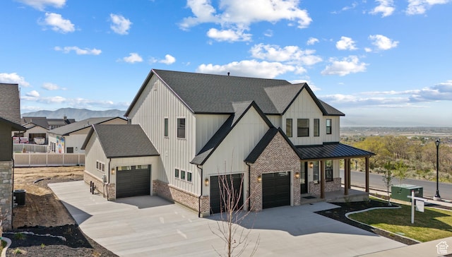 1292 S 1220 E, Salem, UT 84653 - modern farmhouse featuring driveway, a shingled roof, covered porch, an attached garage, and a standing seam roof