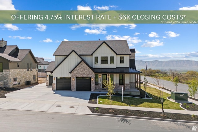 1292 S 1220 E, Salem, UT 84653 - view of front of property featuring board and batten siding, covered porch, driveway, a standing seam roof, and a mountain view