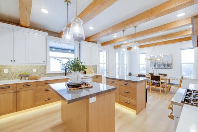 1292 S 1220 E, Salem, UT 84653 - kitchen with plenty of natural light, backsplash, a kitchen island, beam ceiling, and light wood-style flooring