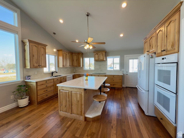 1855 N 860 W, Orem, UT 84057 - kitchen featuring a sink, white appliances, a kitchen island, light countertops, and decorative backsplash