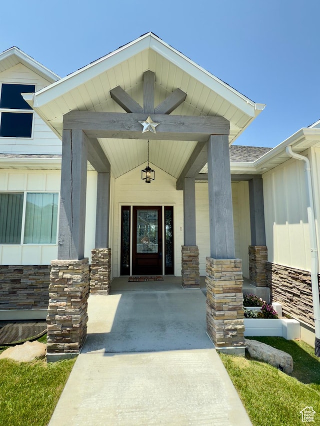 1855 N 860 W, Orem, UT 84057 - property entrance with stone siding, a porch, and board and batten siding