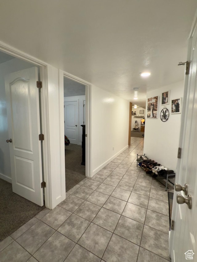 1855 N 860 W, Orem, UT 84057 - hall featuring light tile patterned flooring, light colored carpet, and baseboards
