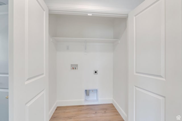 laundry room featuring hookup for a washing machine, baseboards, hookup for an electric dryer, laundry area, and light wood-style flooring