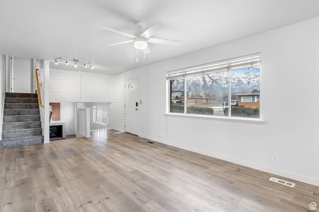 506 S 330 E, American Fork, UT 84003 - unfurnished living room featuring visible vents, ceiling fan, wood finished floors, and baseboards