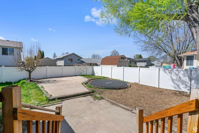 506 S 330 E, American Fork, UT 84003 - view of yard featuring a trampoline, a patio, a residential view, and a fenced backyard
