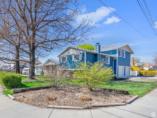 506 S 330 E, American Fork, UT 84003 - view of front of house featuring a chimney, an attached garage, and concrete driveway