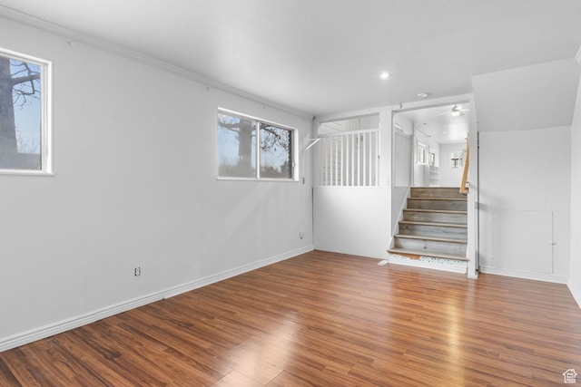 506 S 330 E, American Fork, UT 84003 - spare room with a ceiling fan, stairway, wood finished floors, and a healthy amount of sunlight