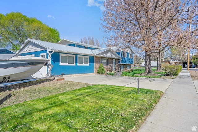 506 S 330 E, American Fork, UT 84003 - view of front facade featuring a front lawn and metal roof