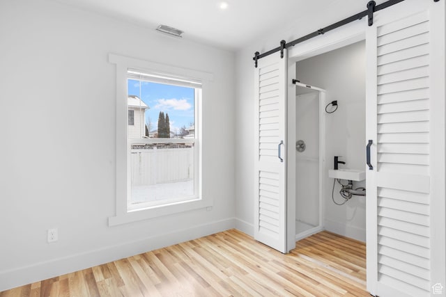 506 S 330 E, American Fork, UT 84003 - bathroom featuring a shower stall, wood finished floors, and baseboards