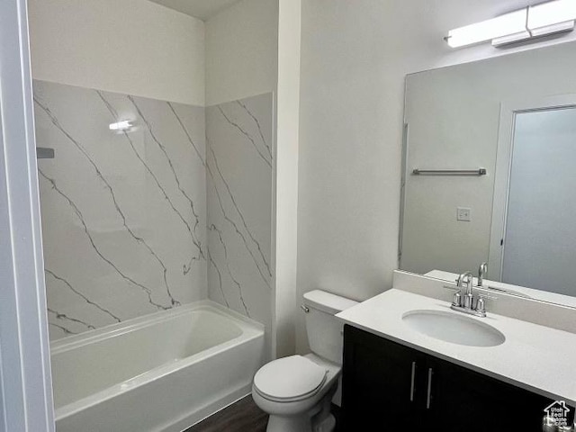 full bathroom with toilet, wood finished floors, vanity, and shower / washtub combination