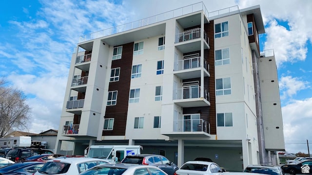 view of property with uncovered parking