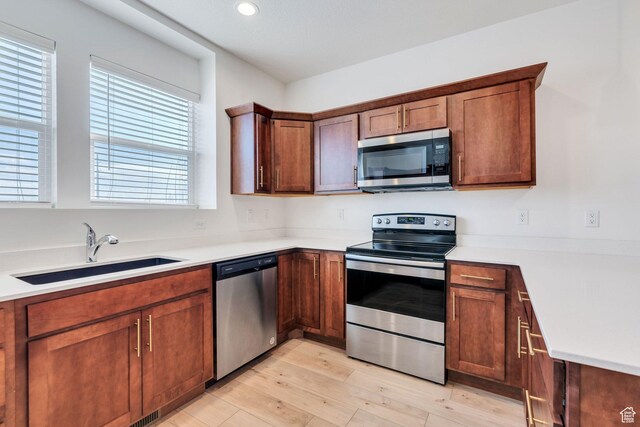 1455 N 3600 W, Lehi, UT 84043 - kitchen featuring stainless steel appliances, sink, and light hardwood / wood-style floors