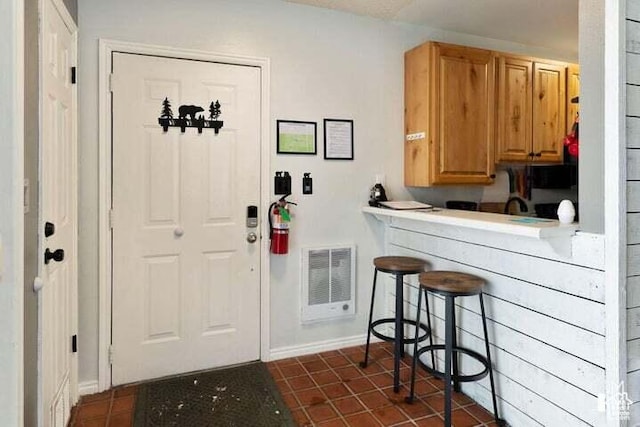 286 W Eagles Roost St Unit A108, Brian Head, UT 84719 - kitchen featuring dark tile patterned floors and a kitchen bar