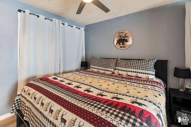 286 W Eagles Roost St Unit A108, Brian Head, UT 84719 - bedroom featuring hardwood / wood-style flooring, ceiling fan, and a textured ceiling