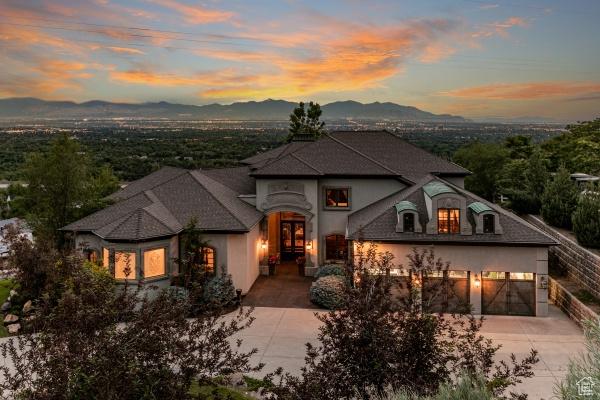 view of front of property with a garage and a mountain view