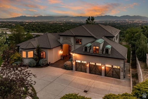 view of front facade featuring a garage and a mountain view
